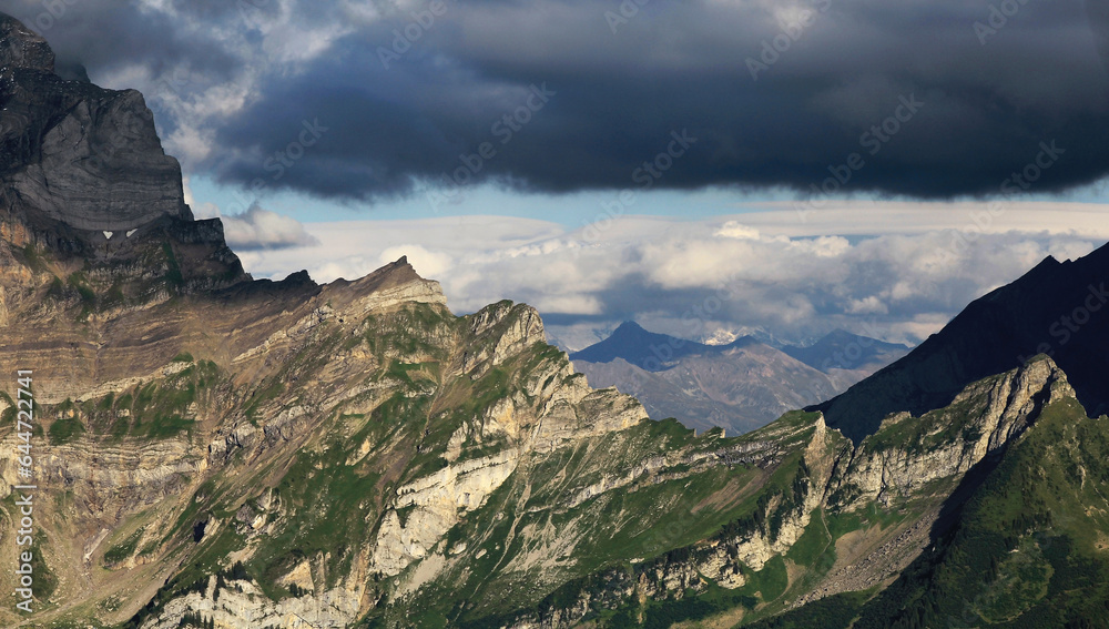 Fototapeta premium Cloud Hanging Over A Mountain Ridge