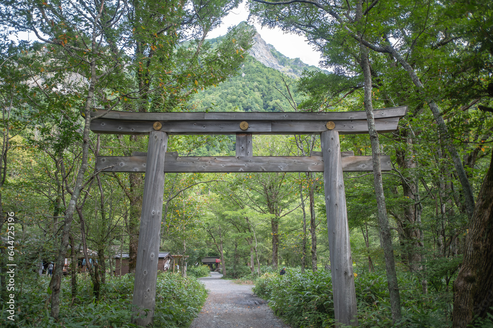 Okunomiya Torii Gate at Okunomiya shrine with Myojin dake moutain background.Kamikochi famous place in  Matsumoto,Nagano,Japan