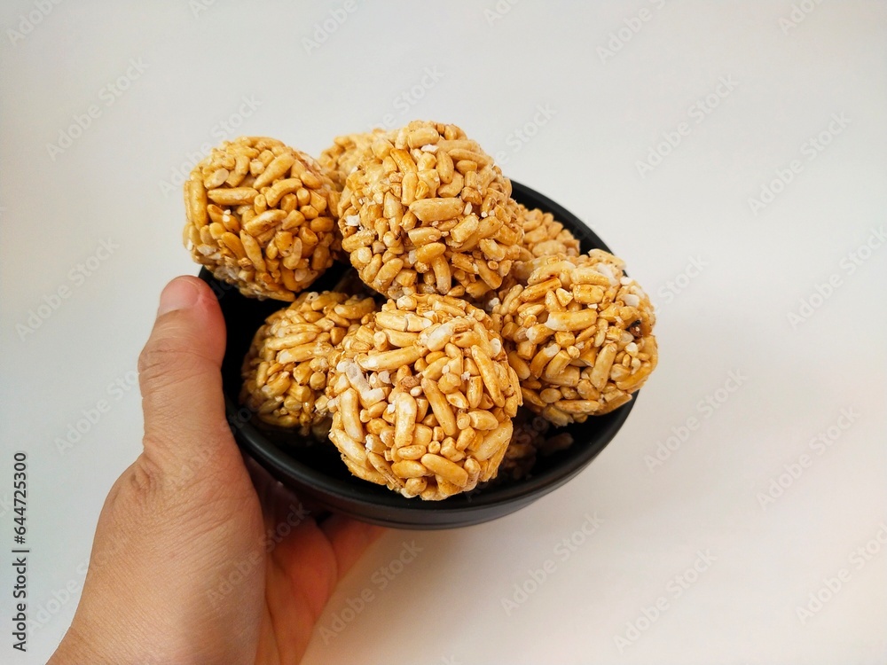 Kue Gipang, Jipang, also named Teng teng Beras one of Indonesian Traditional meal Cereal made from Rice Crispy with Sticky Sugar caramel. Taste Sweet and Crispy, on white background. photo image. Kue Gipang, Jipang, also named Teng teng Beras one of Indonesian Traditional meal Cereal made from Rice Crispy with Sticky Sugar caramel. Taste Sweet and Crispy, on white background. photo image.