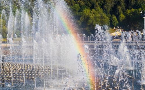 Close up shot of the fountain and the rainbow. Background © Four_Lakes