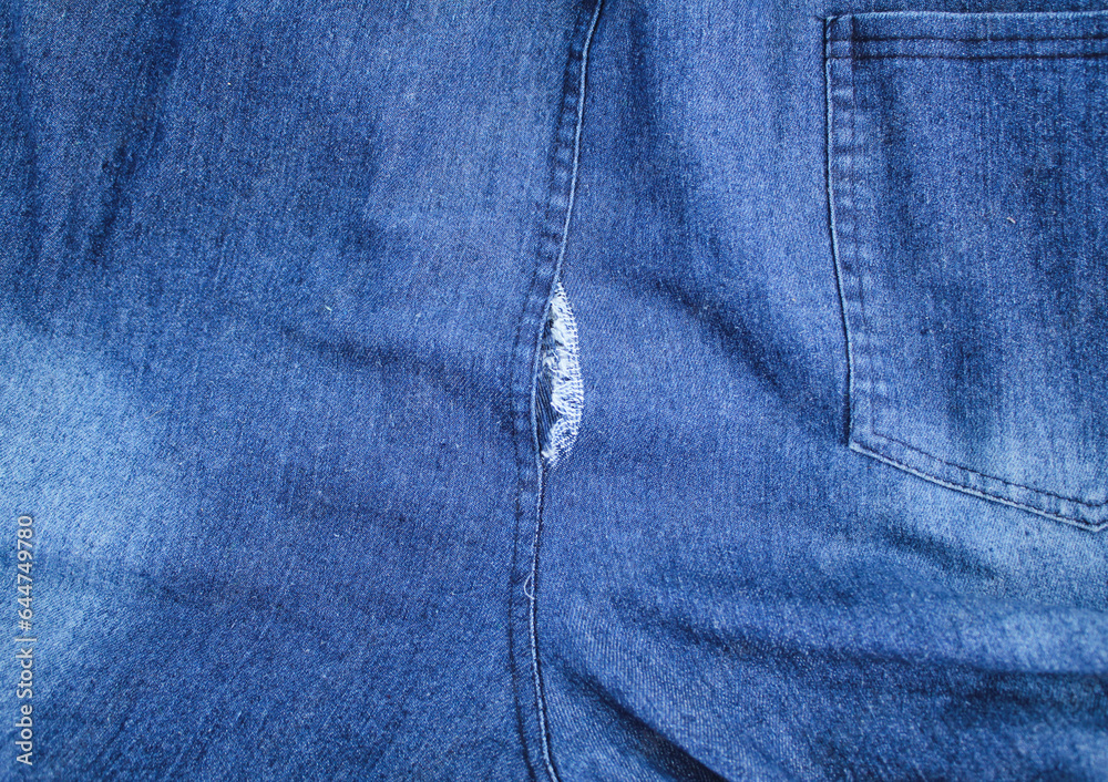 ripped jeans at the back of the butt. the concept of ripped or torn pants. The pants were torn ripped jeans at the back of the butt. the concept of ripped or torn pants. The pants were torn
