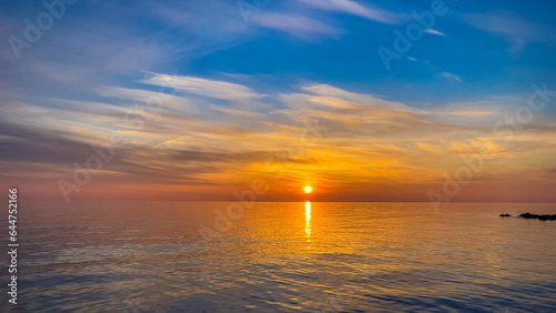 Calm sea with sunset sky In Sochi