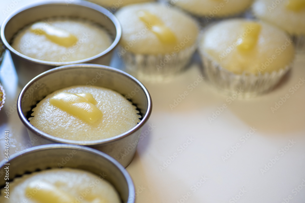 Puto cupcake in an aluminum mold. Hulmahan ng puto. Puto cupcake in an aluminum mold. Hulmahan ng puto.