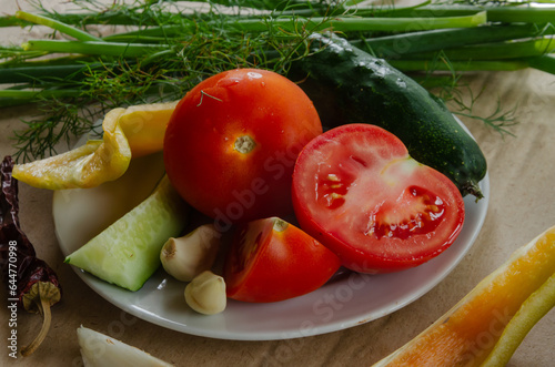 Vegetables and herbs  preparation for salad  are on a plate