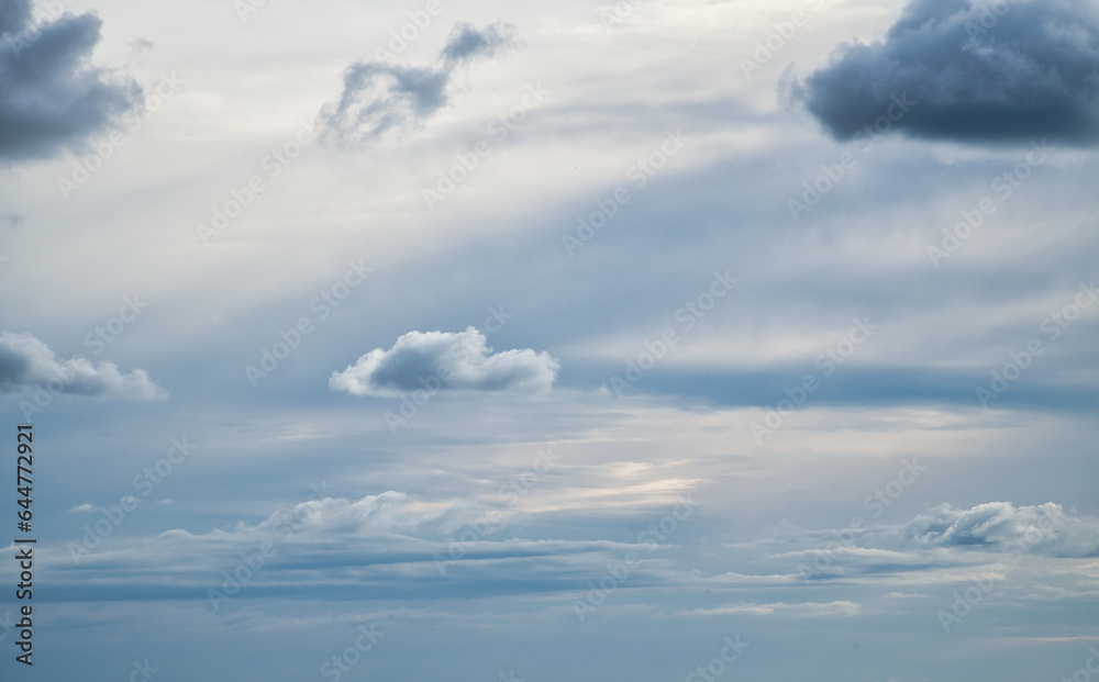 Clouds in the sky. Background image template. light cloud cover with soft sunlight Clouds in the sky. Background image template. light cloud cover with soft sunlight