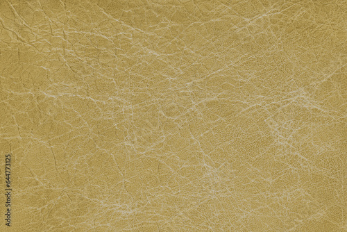 Genuine yellow coarse textured leather, eco friendly leatherette background. Material for upholstery and interior design, sport items and clothes. Wallpaper, banner, backdrop.