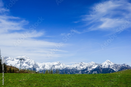 wonderful view to a snowy mountain range during standing on a meadow
