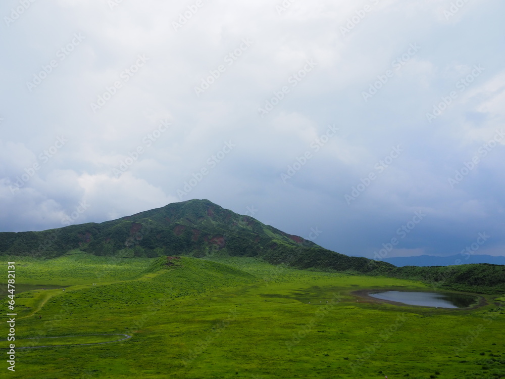 Kusasenri-ga-hama includes a rain fed pool and a 785,000-square-meter grassland growing inside an inactive crater in the foothills of Mt. Eboshi