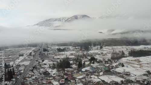 First Snowfall Over Hakuba Valley- Aerial Views Through Early Winter Clouds in Japan