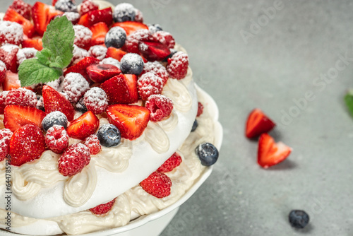 Pavlova cakes with cream and fresh berries on a light background, banner, menu, recipe place for text, top view