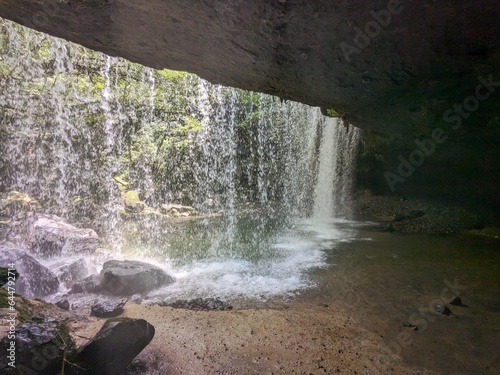 The Nabegataki Falls, where travelers can access the large cavern behind the falls photo