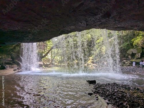 The Nabegataki Falls, where travelers can access the large cavern behind the falls photo