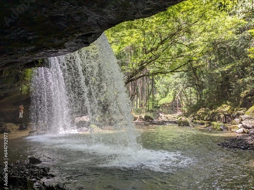 The Nabegataki Falls, where travelers can access the large cavern behind the falls photo