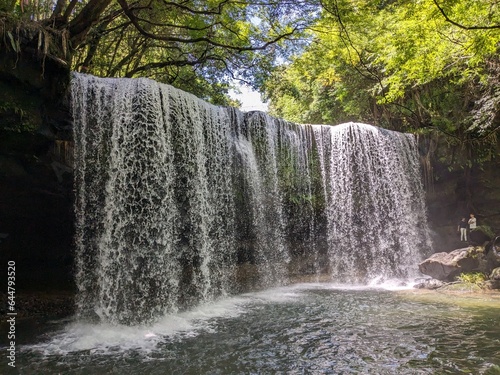 The Nabegataki Falls, where travelers can access the large cavern behind the falls photo