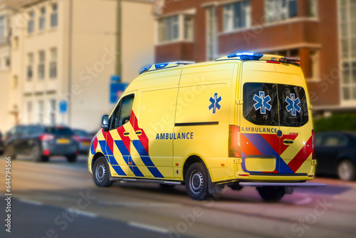 Closeup view of yellow colored emergency ambulance car in the street, Den Haag (The hague), The Nederland.