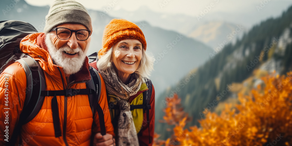 Portrait of senior man and woman hiking in autumn mountains