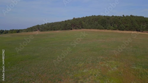 Amazing aerial top view flight 
hilly heath forests summer fields Brandenburg Germany 23. pull in drone
High quality 4k cinematic footage photo