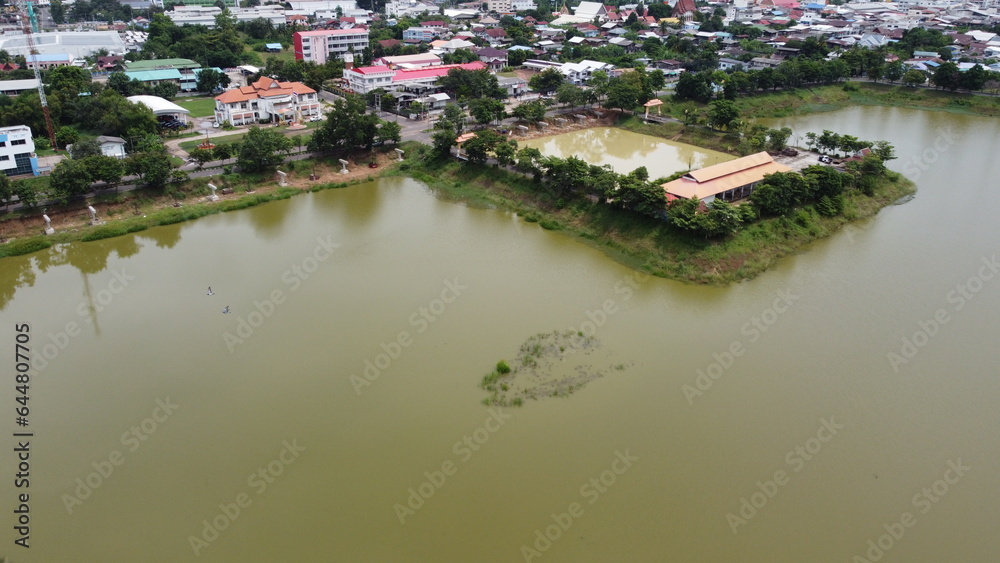 Aerial view of green fields and farmlands in rural Thailand.