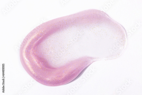 Pink liquid glitter texture with gold shimmer particles on white background.  Isolated on white.