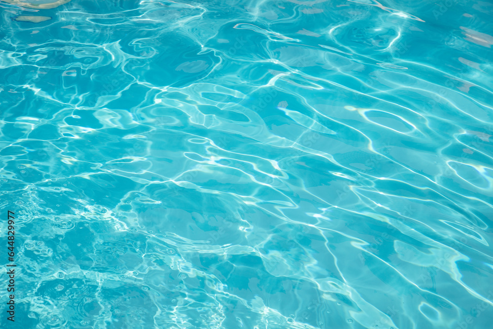 Clear, transparent turquoise water on the swimming pool background