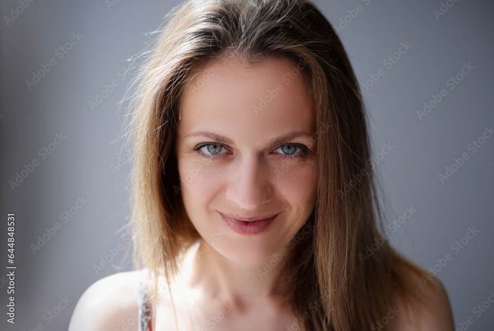 Portrait of woman with light brown hair and blue eyes. Modern women concept Portrait of woman with light brown hair and blue eyes. Modern women concept