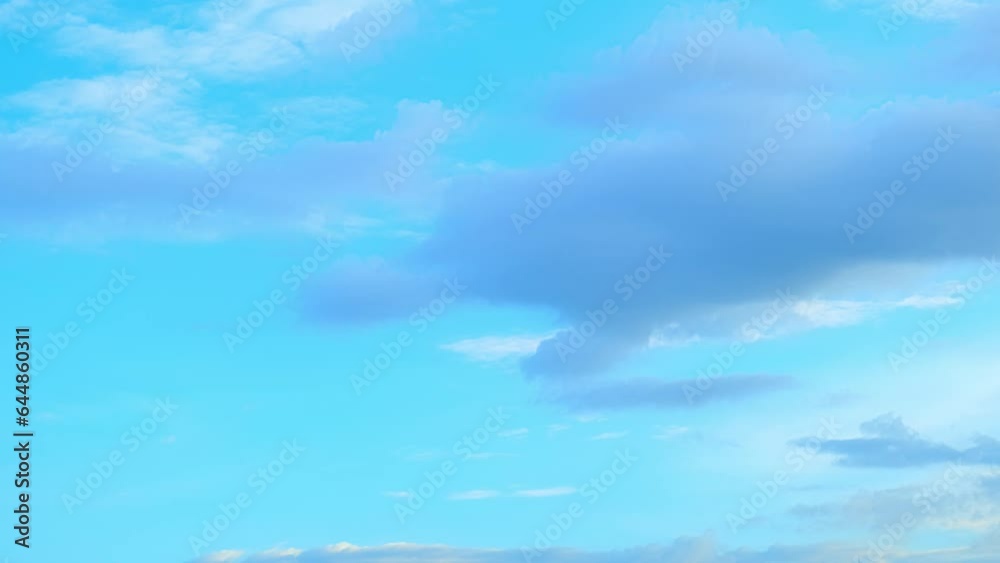 Fluffy clouds moving in the blue sky time-lapse captures the beauty and serenity of nature. The clouds appear to be dancing and changing shape in a tranquil blue sky, creating a mesmerizing effect.
Fluffy clouds moving in the blue sky time-lapse captures the beauty and serenity of nature. The clouds appear to be dancing and changing shape in a tranquil blue sky, creating a mesmerizing effect.