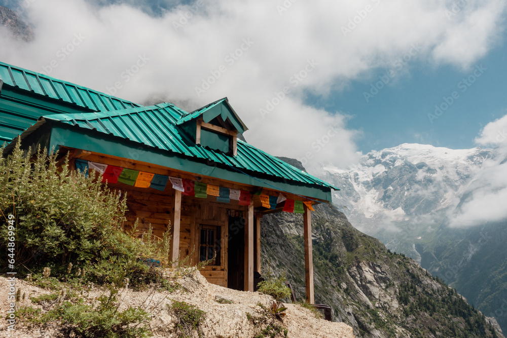 A traditional homestay nestled in the Kinner Kailash Mountain range amid mountains and valleys.