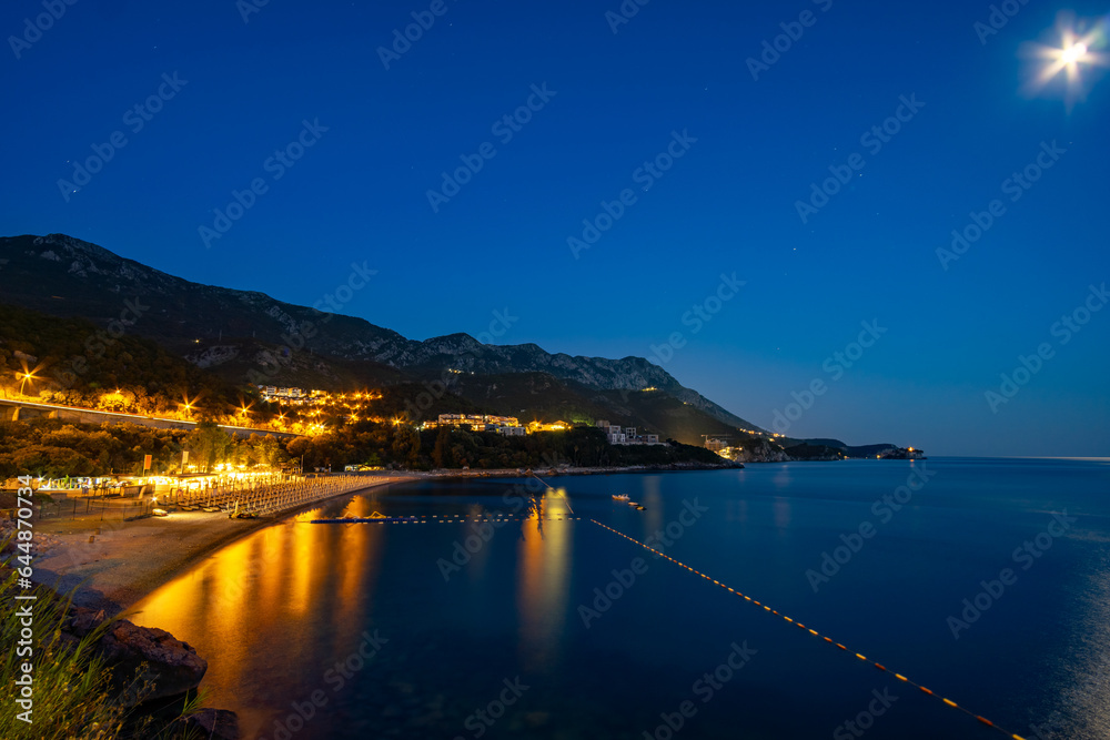 night view of beautiful seaside resort, sea and beach, city streets, adriatic sea, summer holiday background