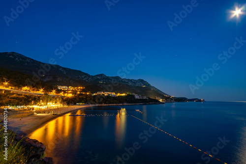 night view of beautiful seaside resort, sea and beach, city streets, adriatic sea, summer holiday background