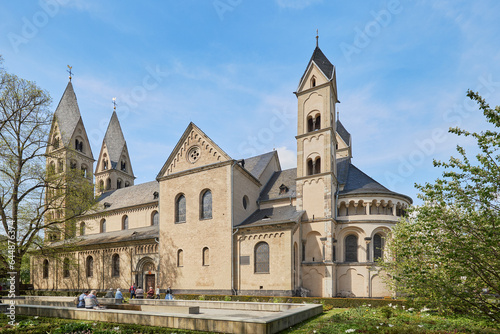 View of the Basilica of St. Castor and its gardens in Cologne, Germany.
