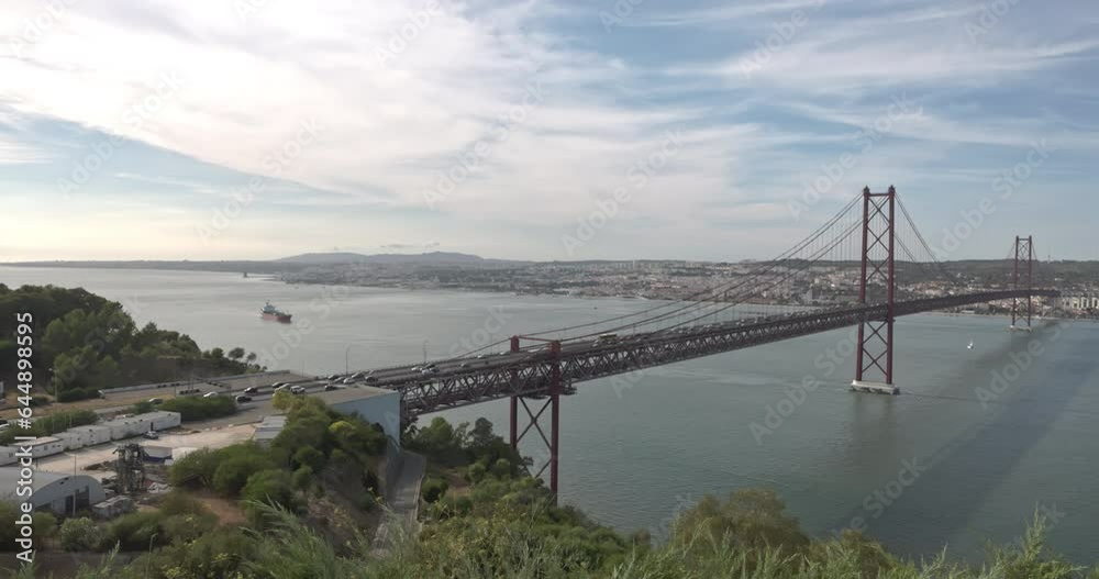 25 de Abril Bridge, with the city of Lisbon in the background. 25 de Abril Bridge, with the city of Lisbon in the background.