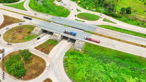 A dogbone interchange, seen from a drone's aerial view, resembles a bone-shaped road configuration, efficiently connecting two major highways.
 photo