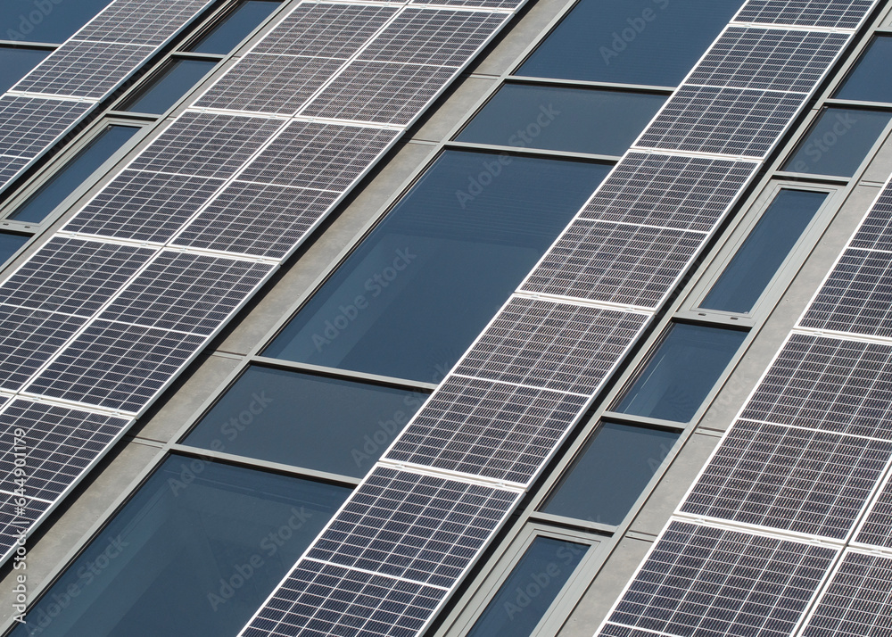 Fototapeta premium Modern Building Facade Adorned with Solar Panels