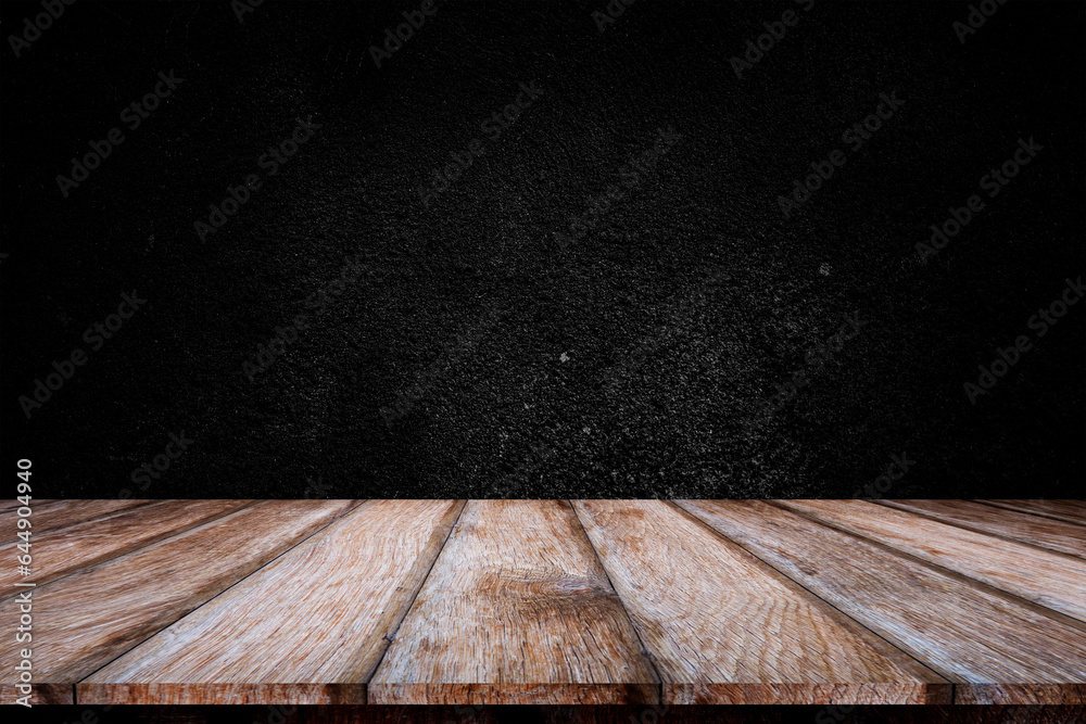 Wooden table or counter top with black stone wall background. Wooden table or counter top with black stone wall background.