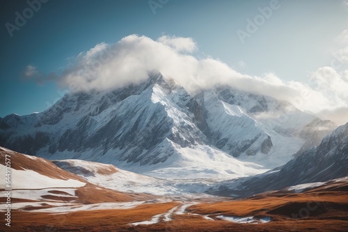 Majestic Winter Mountain Range at Sunrise with Snowfall and Panoramic Sky