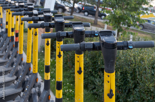 Parking of electric scooters on the street of a modern city