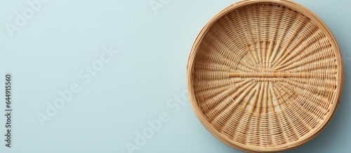 Photograph of bamboo basket on a isolated pastel background Copy space