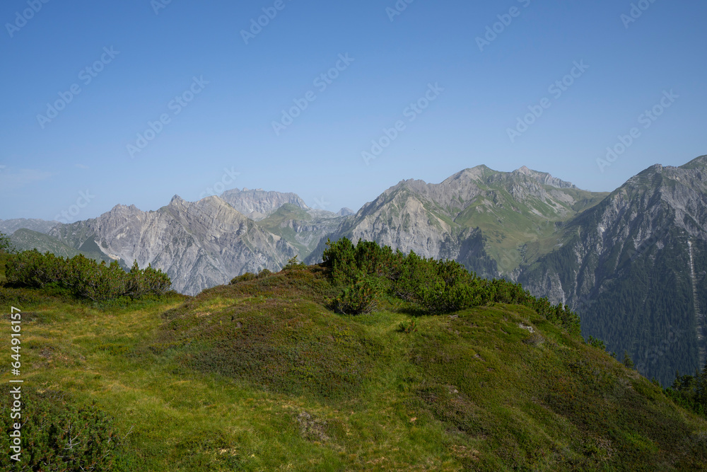 Obraz premium mountain landscape with view on alpine summits and blue sky