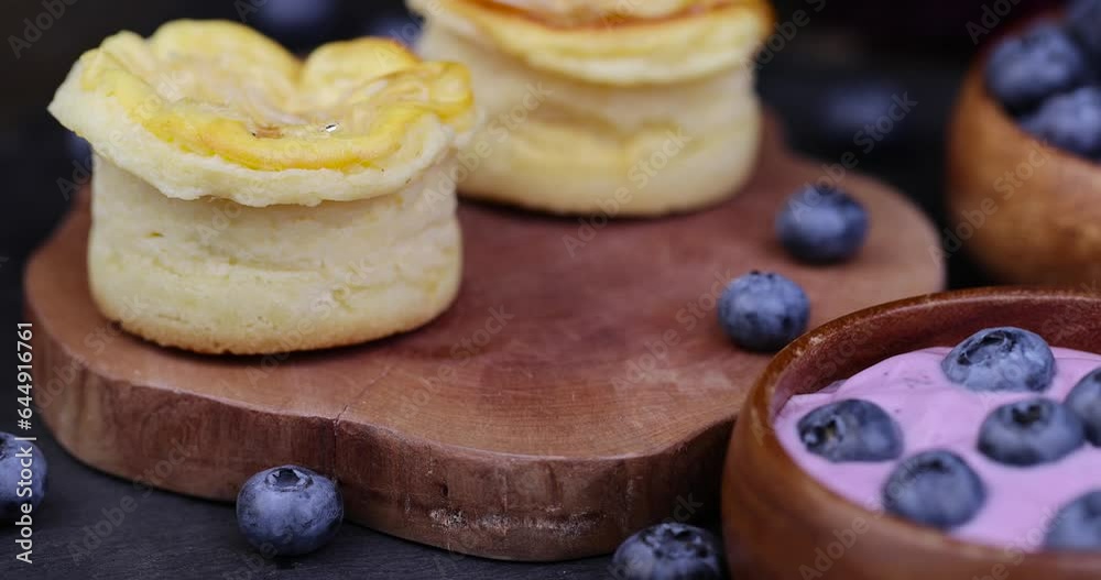 focus on blueberry cheesecake with blueberries and blueberries and blueberry jam, delicious and sweet dessert cheesecake on the table