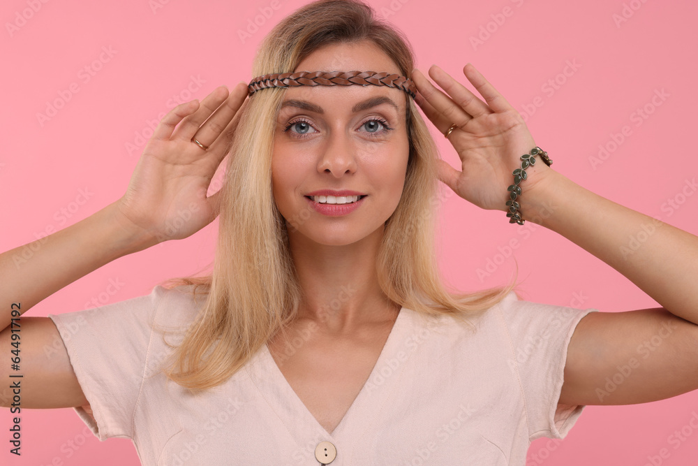 Portrait of beautiful hippie woman on pink background Portrait of beautiful hippie woman on pink background
