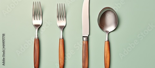 Arranged utensils on table isolated pastel background Copy space