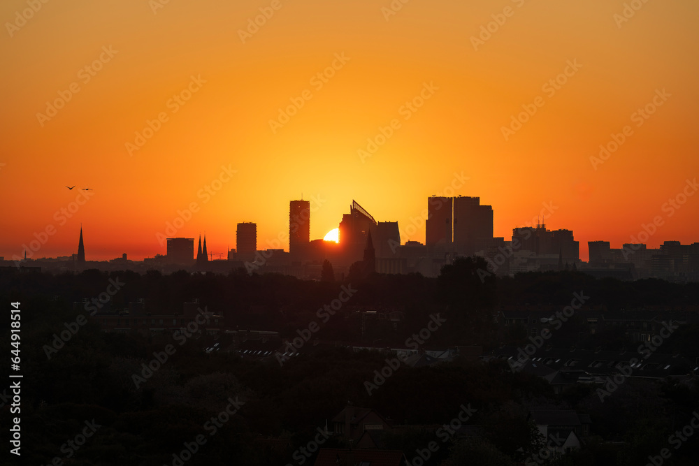 Naklejka premium Skyline The Hague with a beautiful red yellow sunrise 