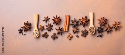 Wooden utensils with spices on isolated pastel background Copy space