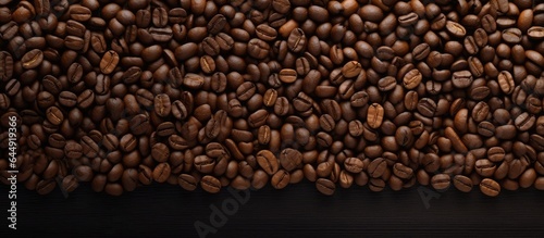 Hot coffee in a fresh dark cup with a black isolated pastel background Copy space and beans