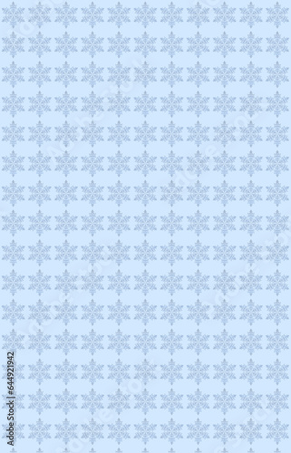 Vertical christmas pattern of blue snowflakes on a light blue canvas