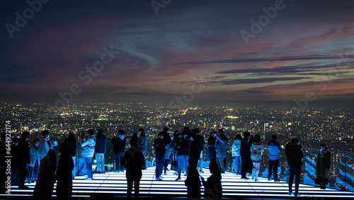tokyo shibuya skydeck at dusk with people and lights