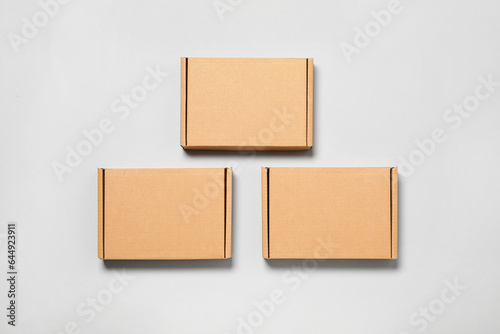 Cardboard boxes on white background, flat lay. Packaging goods © New Africa