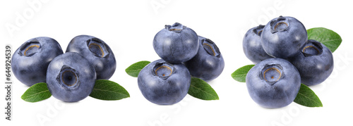 Set with fresh blueberries and green leaves isolated on white