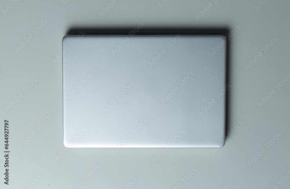 Top-down view of a laptop on a minimalist table Top-down view of a laptop on a minimalist table