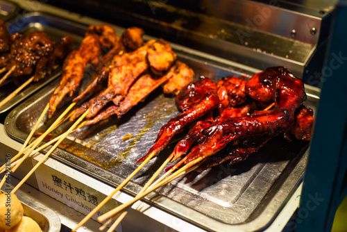Canvas Print Grilled honey chicken wings in Jalan Alor street food in Kuala Lumpur